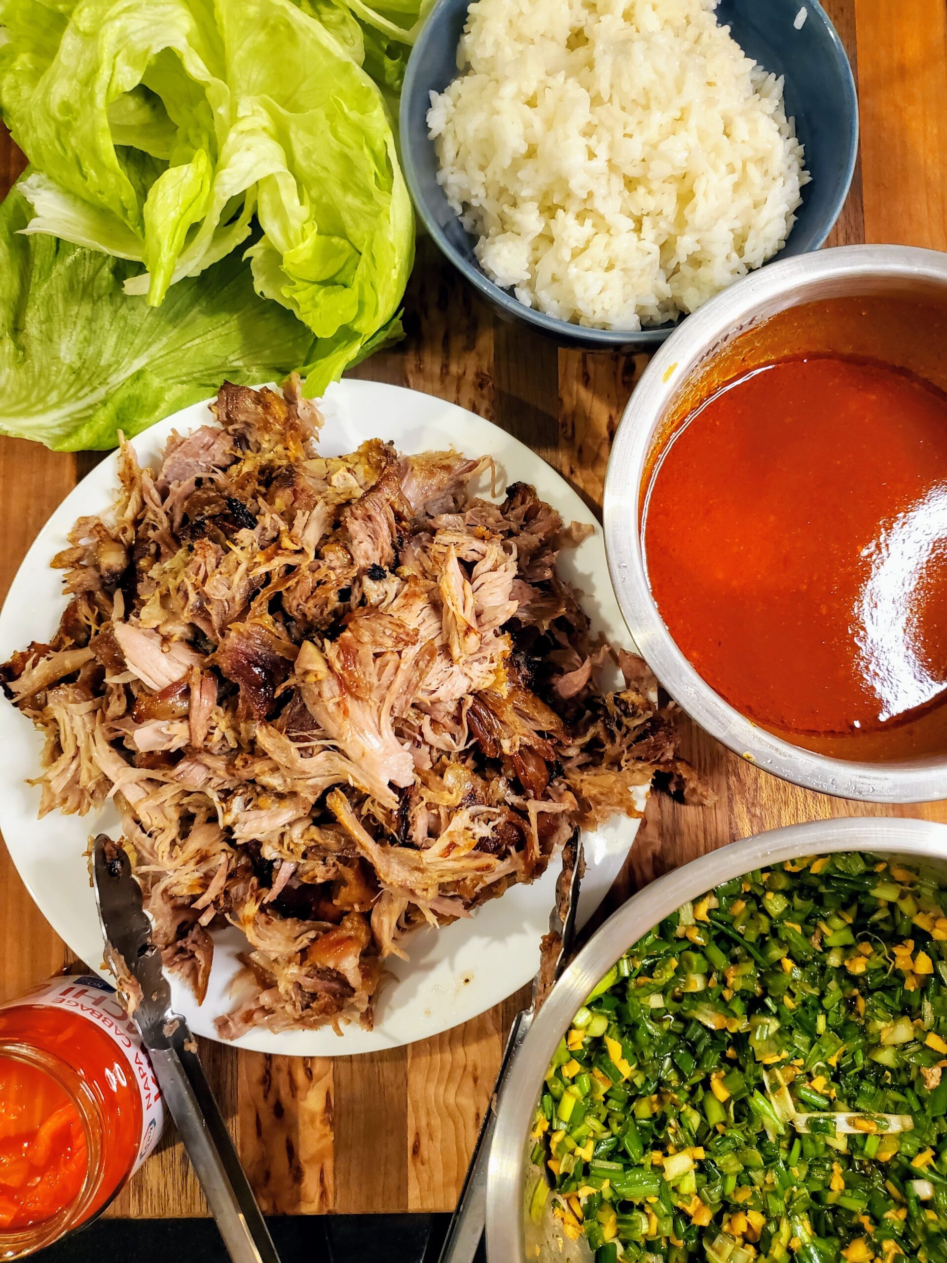 Pork lettuce and rice on a board